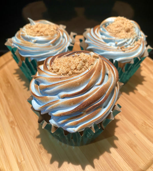S’more Than a Feeling: Purple Witch Tea's "S'mores" Tea Cupcake, Salted Caramel Filling, Toasted Blue Butterfly Pea Flower Marshmallow Meringue, Graham Cracker Topping